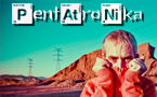 Close-up of the singer in a desert with the name of the group at the background